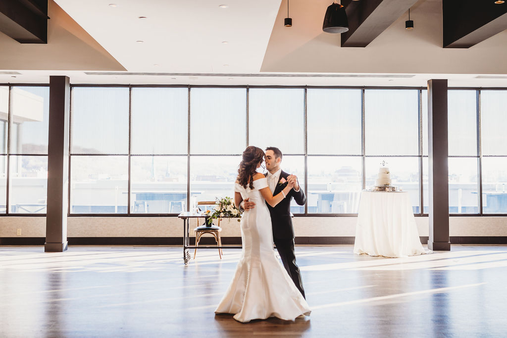 Bride and groom slow dancing.